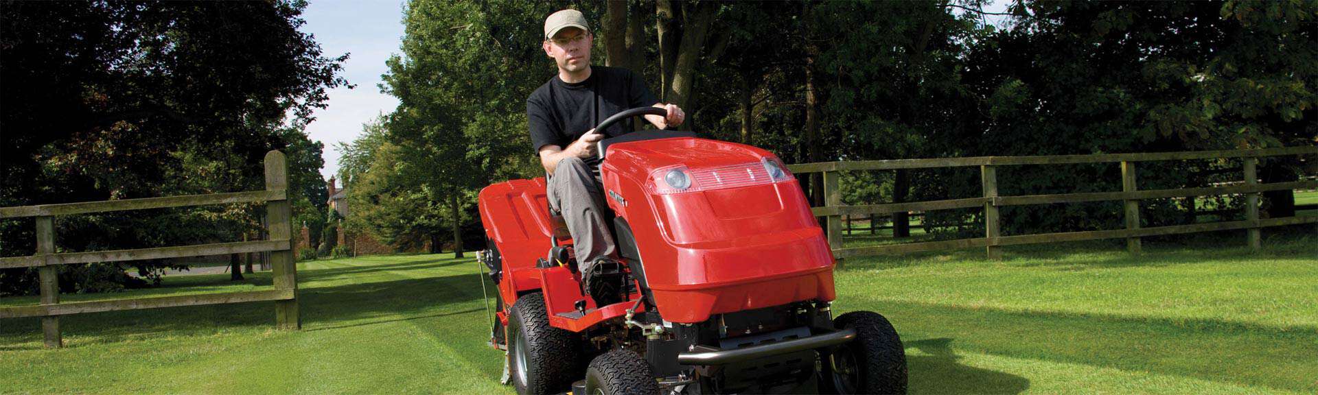 Man on a red lawnmower